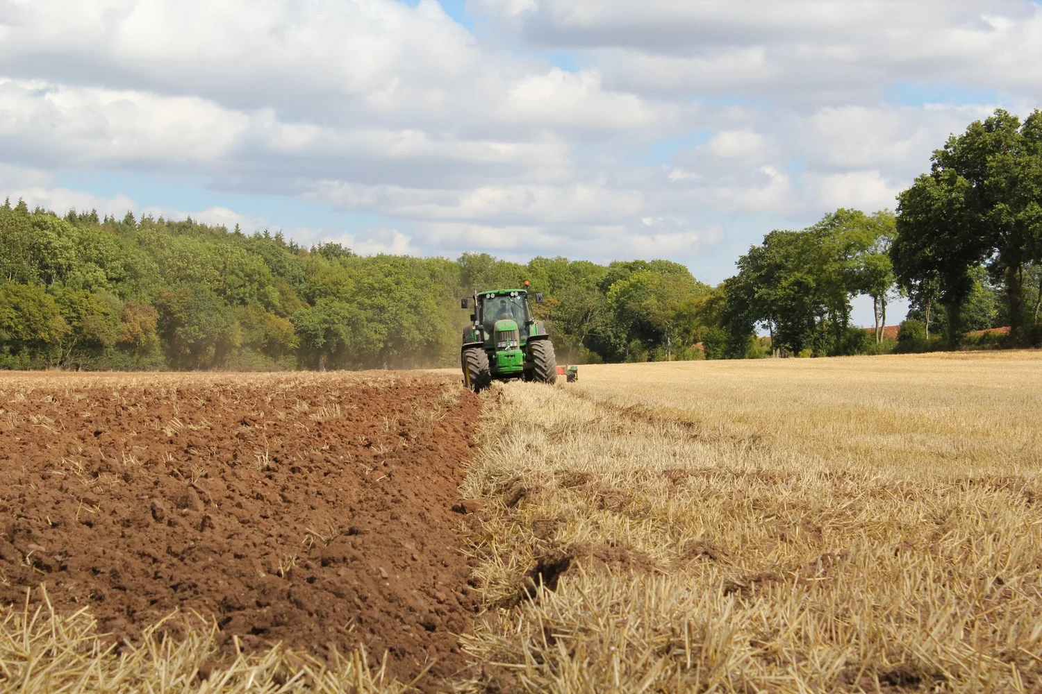 A tractor plowing a field